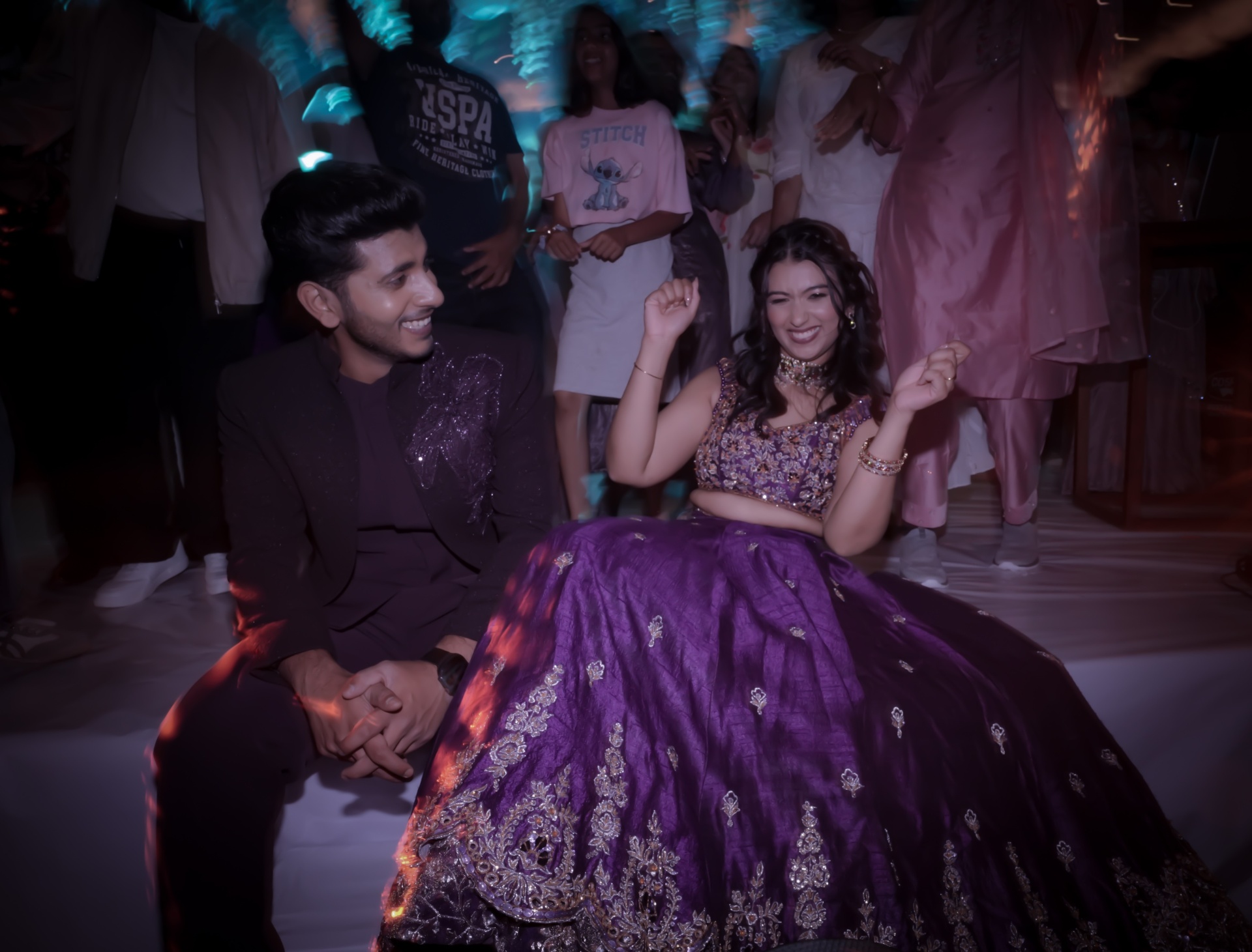 Alisha in embellished purple lehenga with Febin in coordinated sherwani at the sangeet