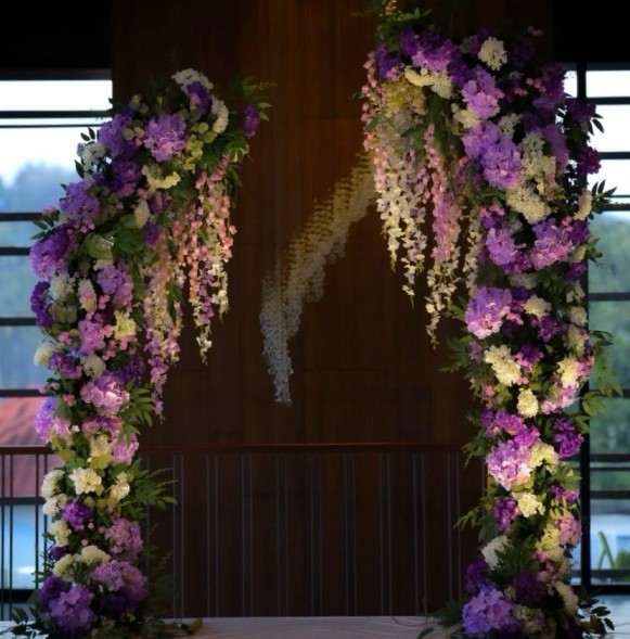 Lilac and ivory floral arch designed in house for the ceremony